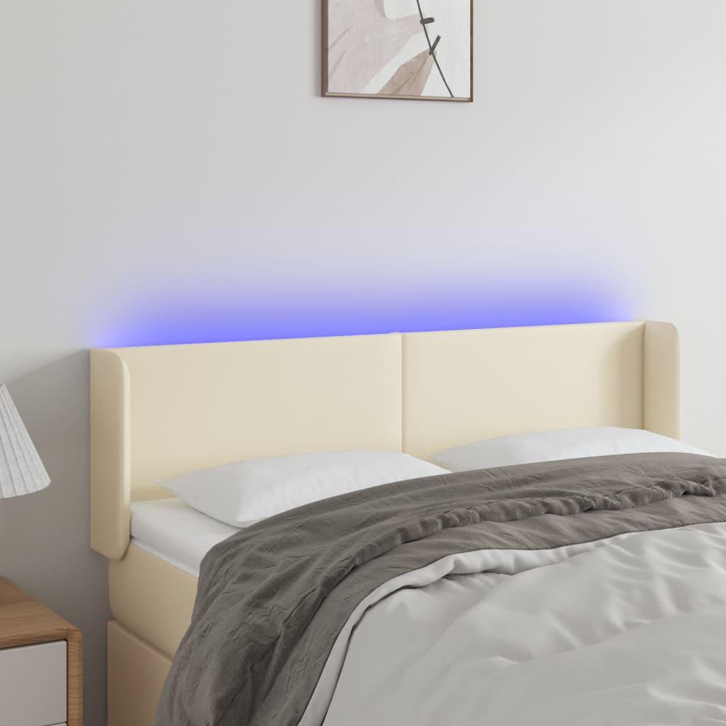 Sengegavl med LED-lys 147x16x78/88 cm kunstlæder cremefarvet billede