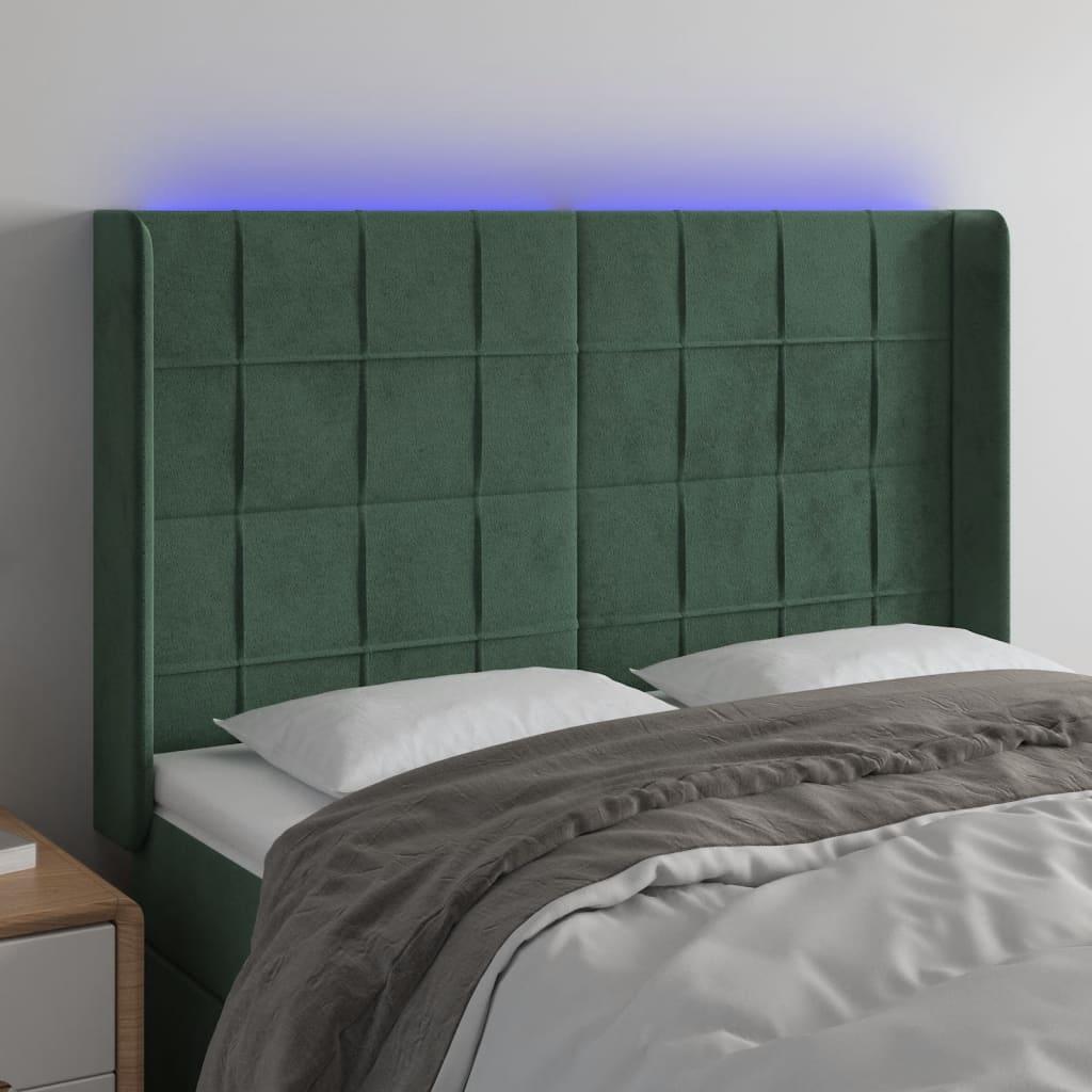 Sengegavl med LED-lys 147x16x118/128 cm fløjl mørkegrøn billede