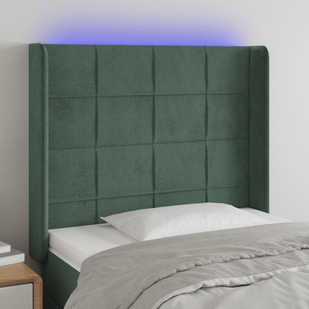 Sengegavl med LED-lys 103x16x118/128 cm fløjl mørkegrøn billede