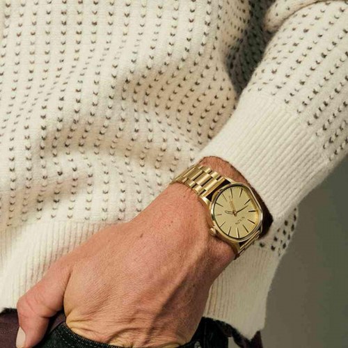 Nixon A1461-502 dameur - elegant armbåndsur i guldtone