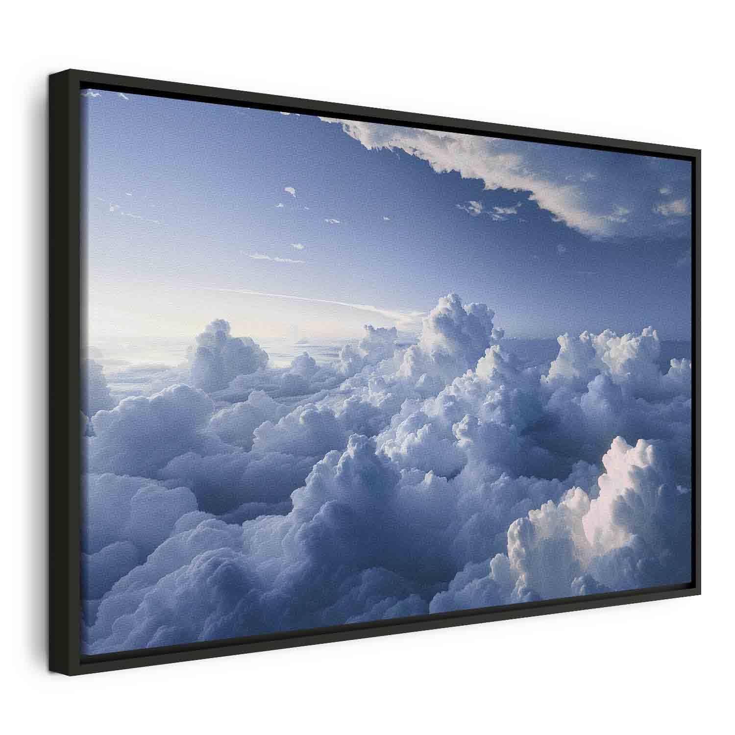 Lærredsbillede - Luftlandskaber: Solstråler oplyser bløde skyformationer - 120 x 80 cm - I en sort træramme