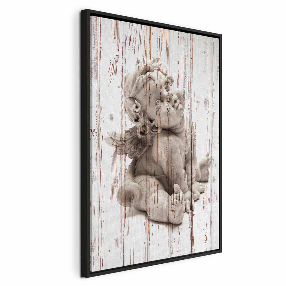 Lærredsbillede Pensive Cupid lodret 1 del - 40 x 60 cm - I en sort træramme