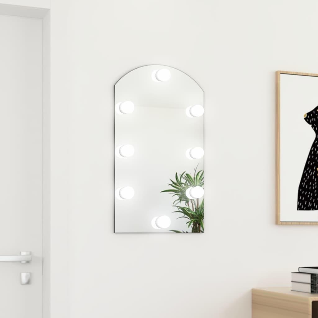 Spejl med LED-lamper 70x40 cm buet glas