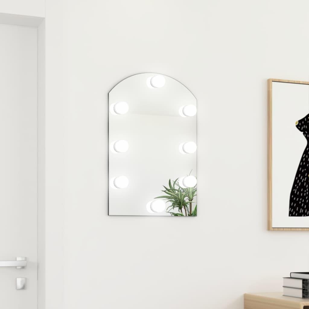 Spejl med LED-lamper 60x40 cm buet glas