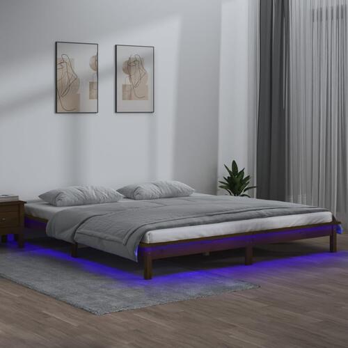 Sengeramme med LED-lys 120x190 cm massivt træ gyldenbrun