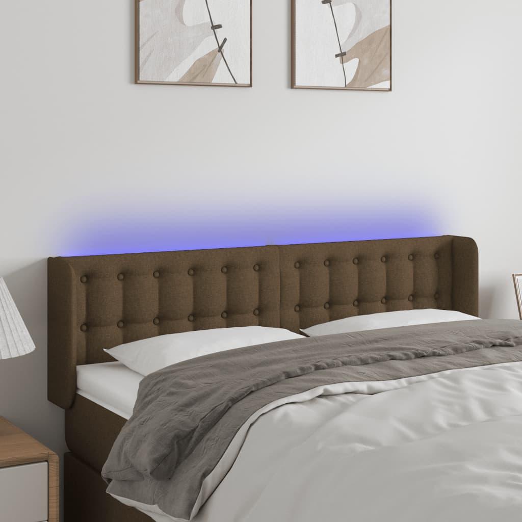Sengegavl med LED-lys 147x16x78/88 cm stof mørkebrun billede