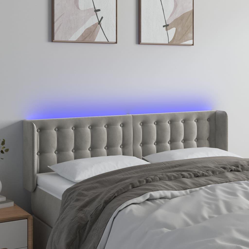 Sengegavl med LED-lys 147x16x78/88 cm fløjl lysegrå billede