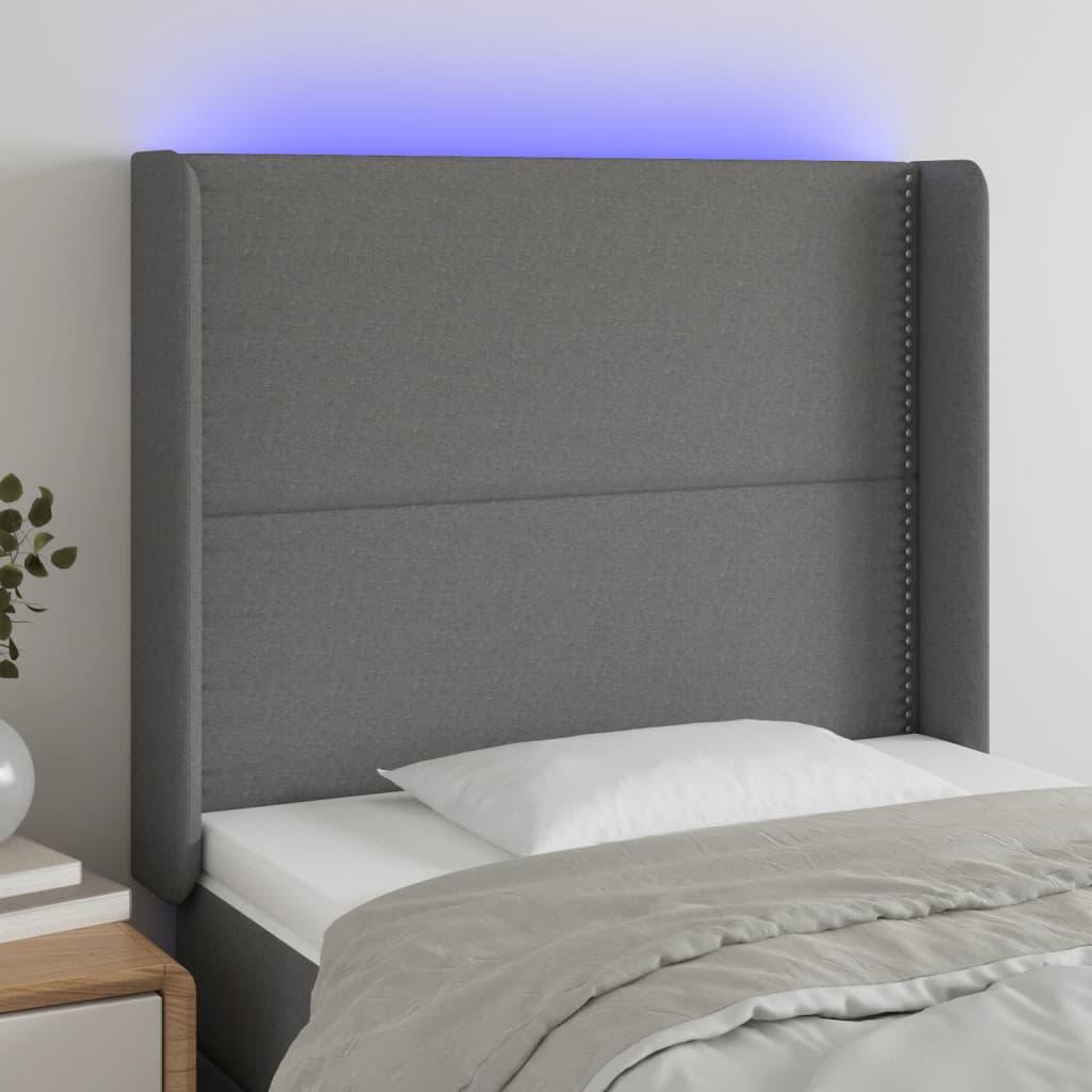 Sengegavl med LED-lys 93x16x118/128 cm stof mørkegrå billede