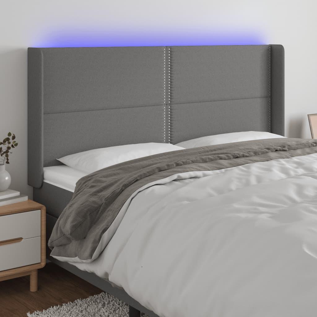 Sengegavl med LED-lys 203x16x118/128 cm stof mørkegrå billede