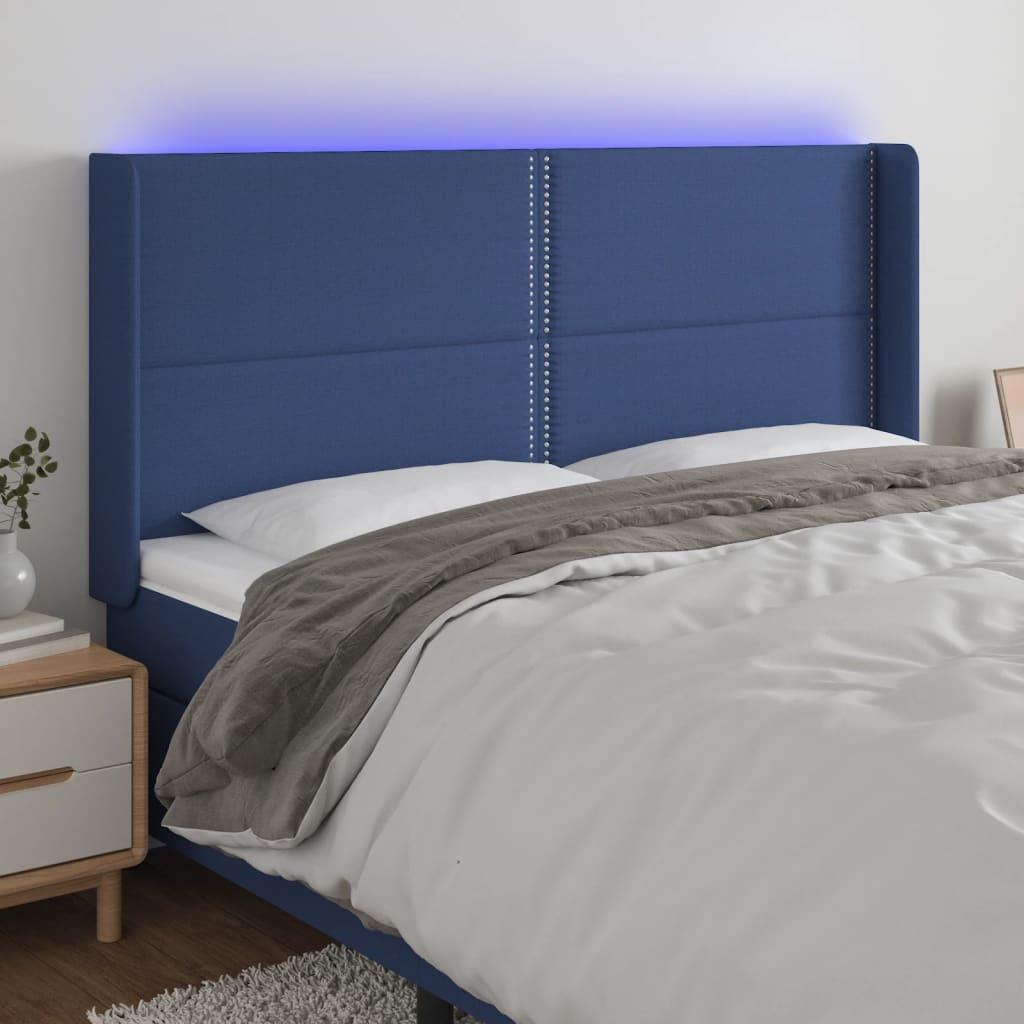 Sengegavl med LED-lys 203x16x118/128 cm stof blå billede