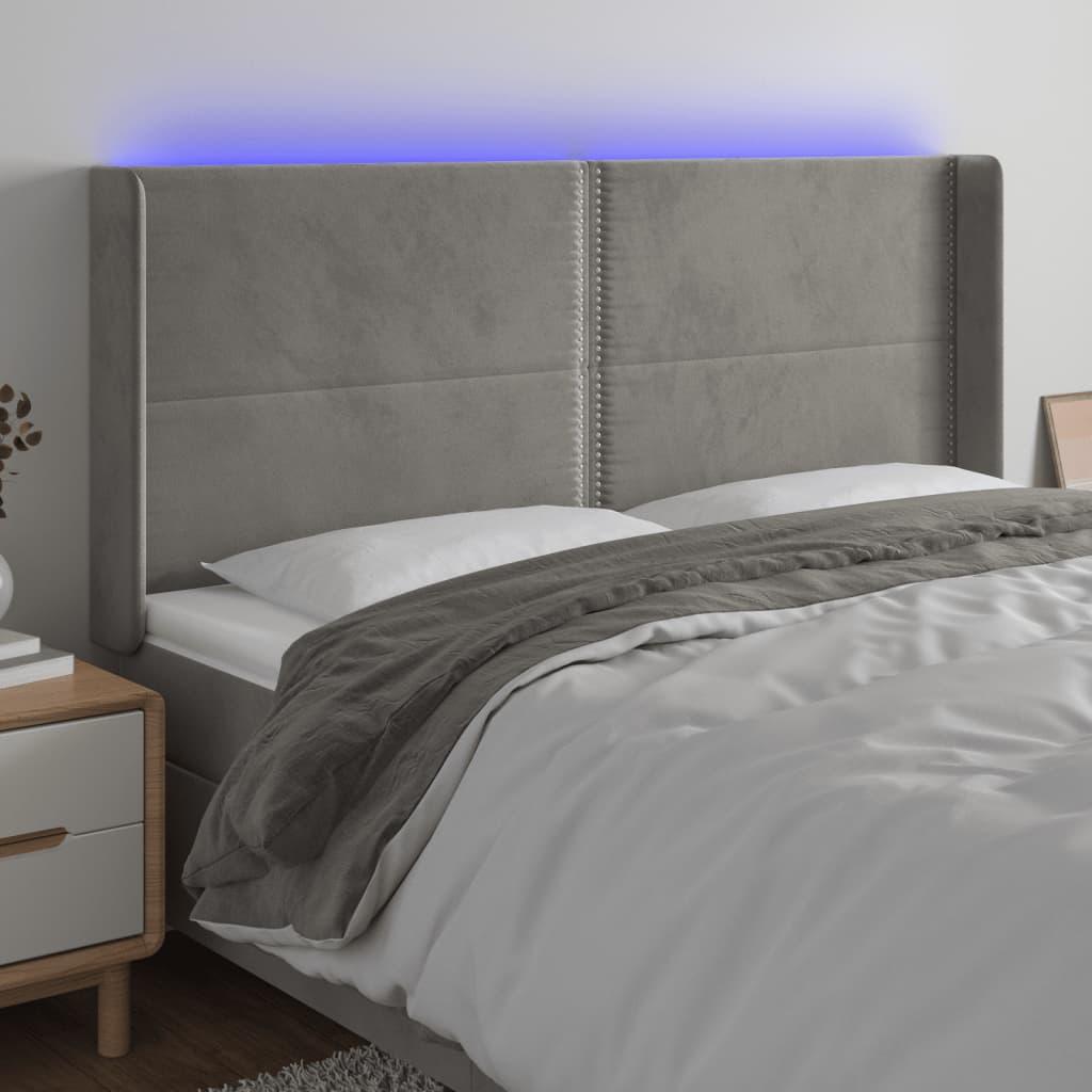 Sengegavl med LED-lys 203x16x118/128 cm - fløjl, lysegrå billede