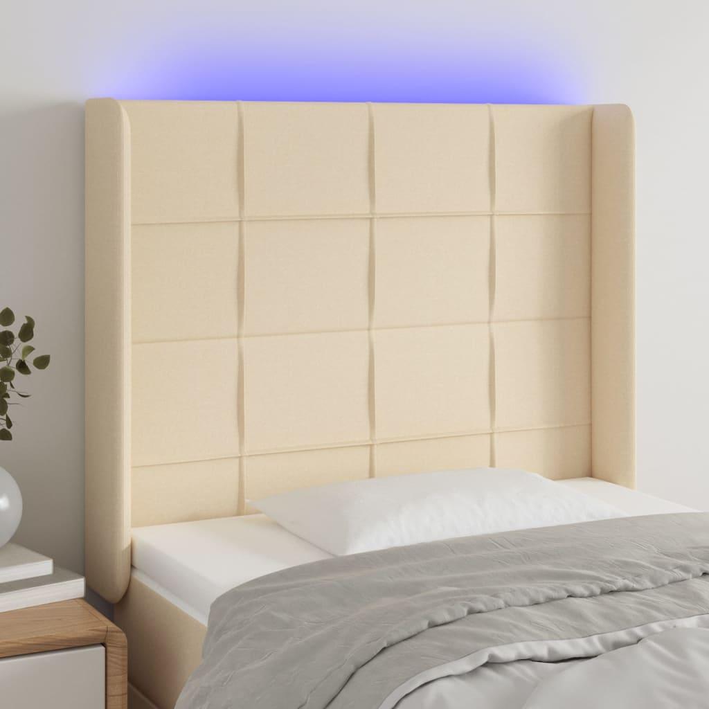 Sengegavl med LED-lys 93x16x118/128 cm stof cremefarvet billede