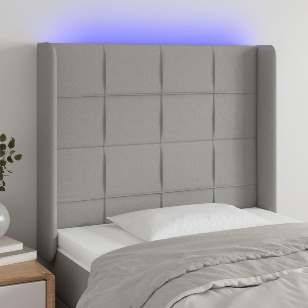 Sengegavl med LED-lys 103x16x118/128 cm stof lysegrå billede
