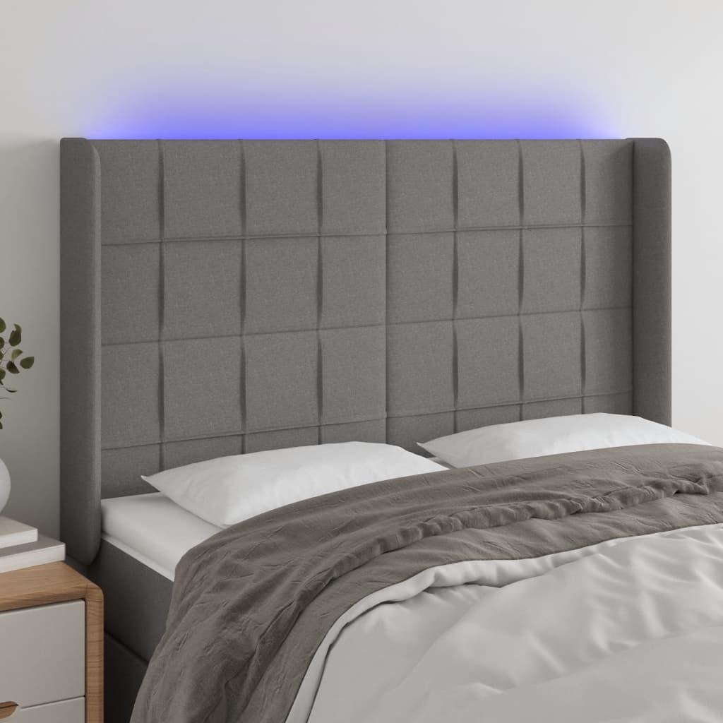 Sengegavl med LED-lys 147x16x118/128 cm stof mørkegrå billede