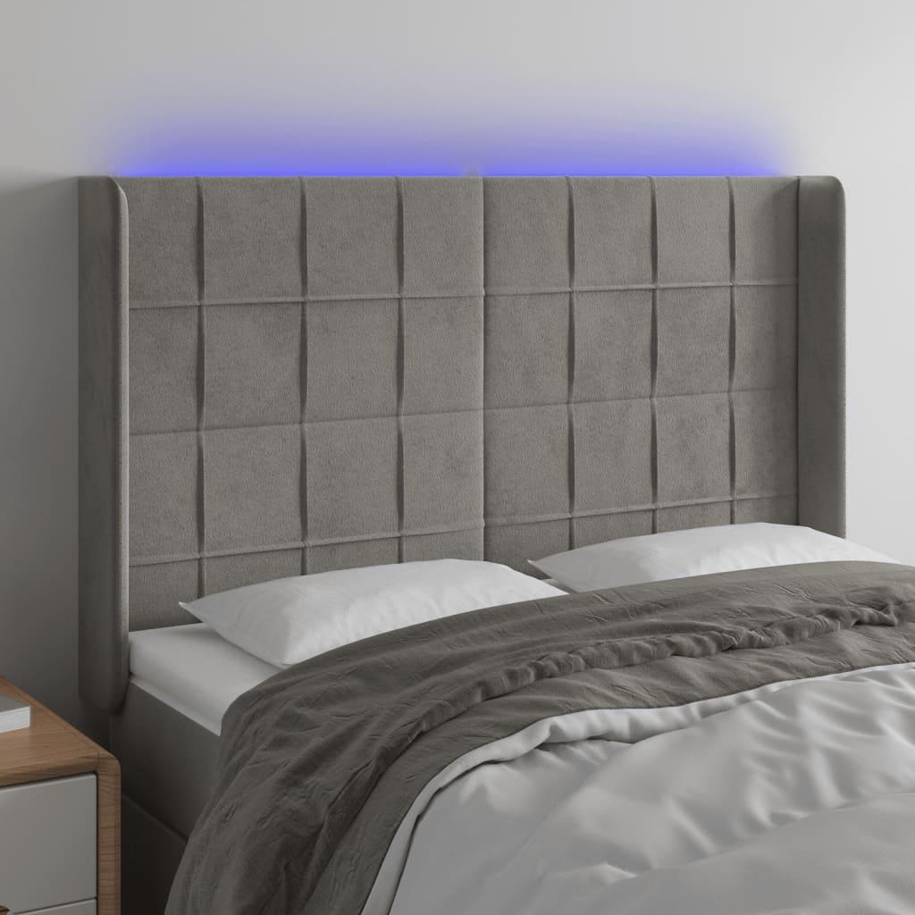 Sengegavl med LED-lys 147x16x118/128 cm fløjl lysegrå billede