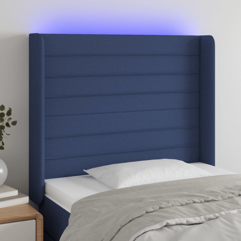 Sengegavl med LED-lys 103x16x118/128 cm stof blå billede