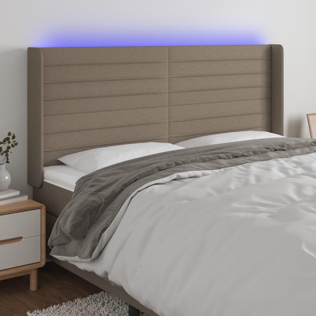 Sengegavl med LED-lys 163x16x118/128 cm stof gråbrun billede