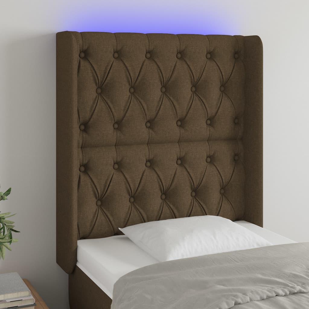 Sengegavl med LED-lys 83x16x118/128 cm stof mørkebrun billede
