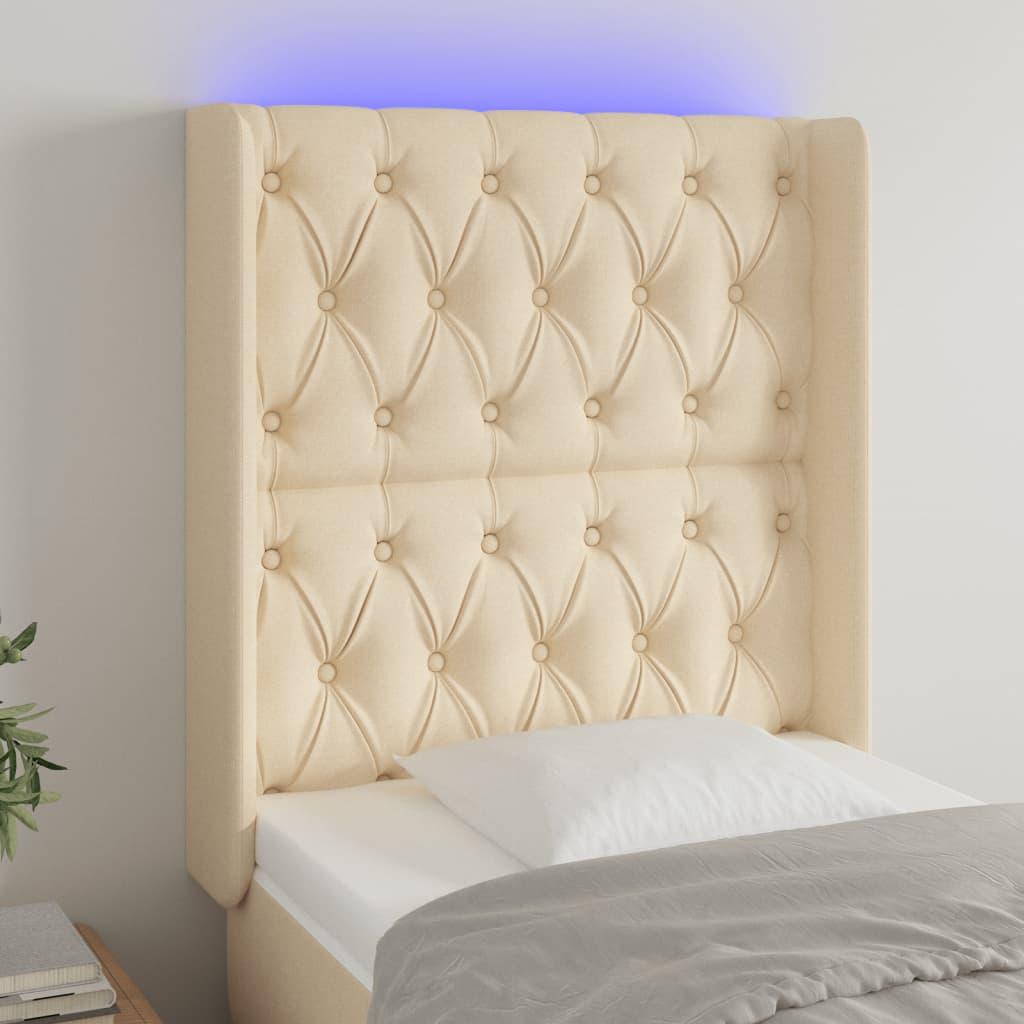 Sengegavl med LED-lys 83x16x118/128 cm stof cremefarvet billede