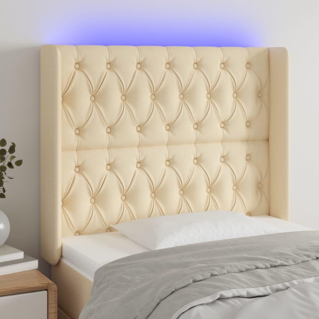 Sengegavl med LED-lys 93x16x118/128 cm stof cremefarvet billede