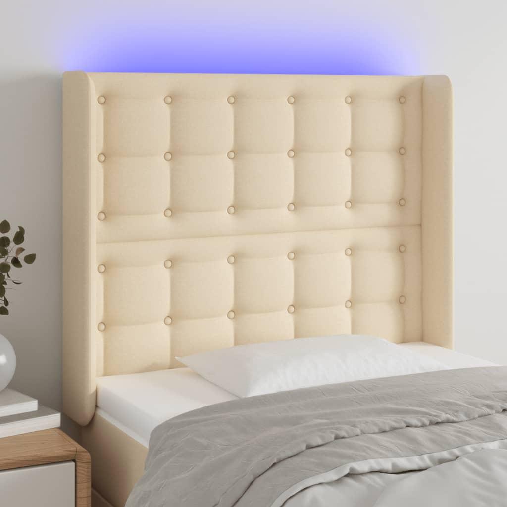 Sengegavl med LED-lys 93x16x118/128 cm stof cremefarvet billede