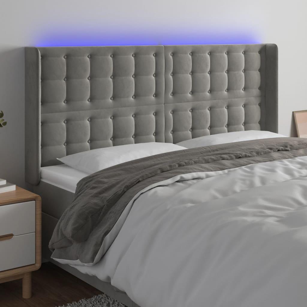 Sengegavl med LED-lys 203x16x118/128 cm - fløjl, lysegrå billede