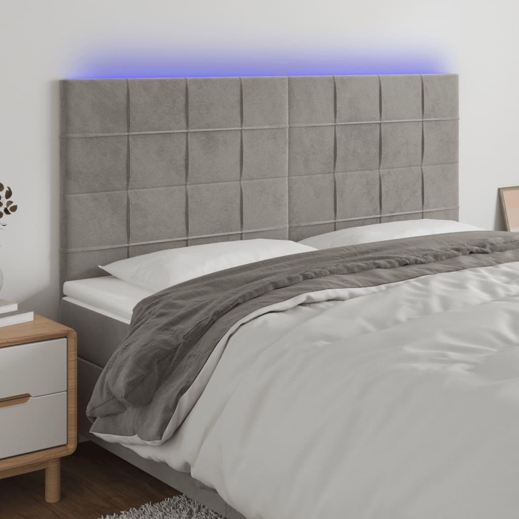Sengegavl med LED-lys 200x5x118/128 cm fløjl lysegrå billede
