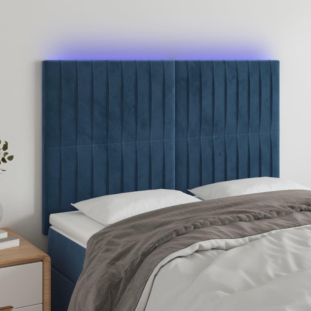Sengegavl med LED-lys 144x5x118/128 cm fløjl mørkeblå billede