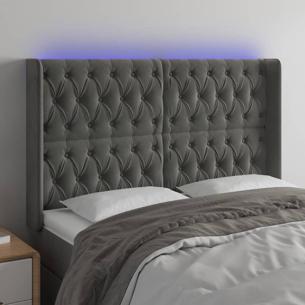 Sengegavl med LED-lys 147x16x118/128 cm fløjl mørkegrå billede