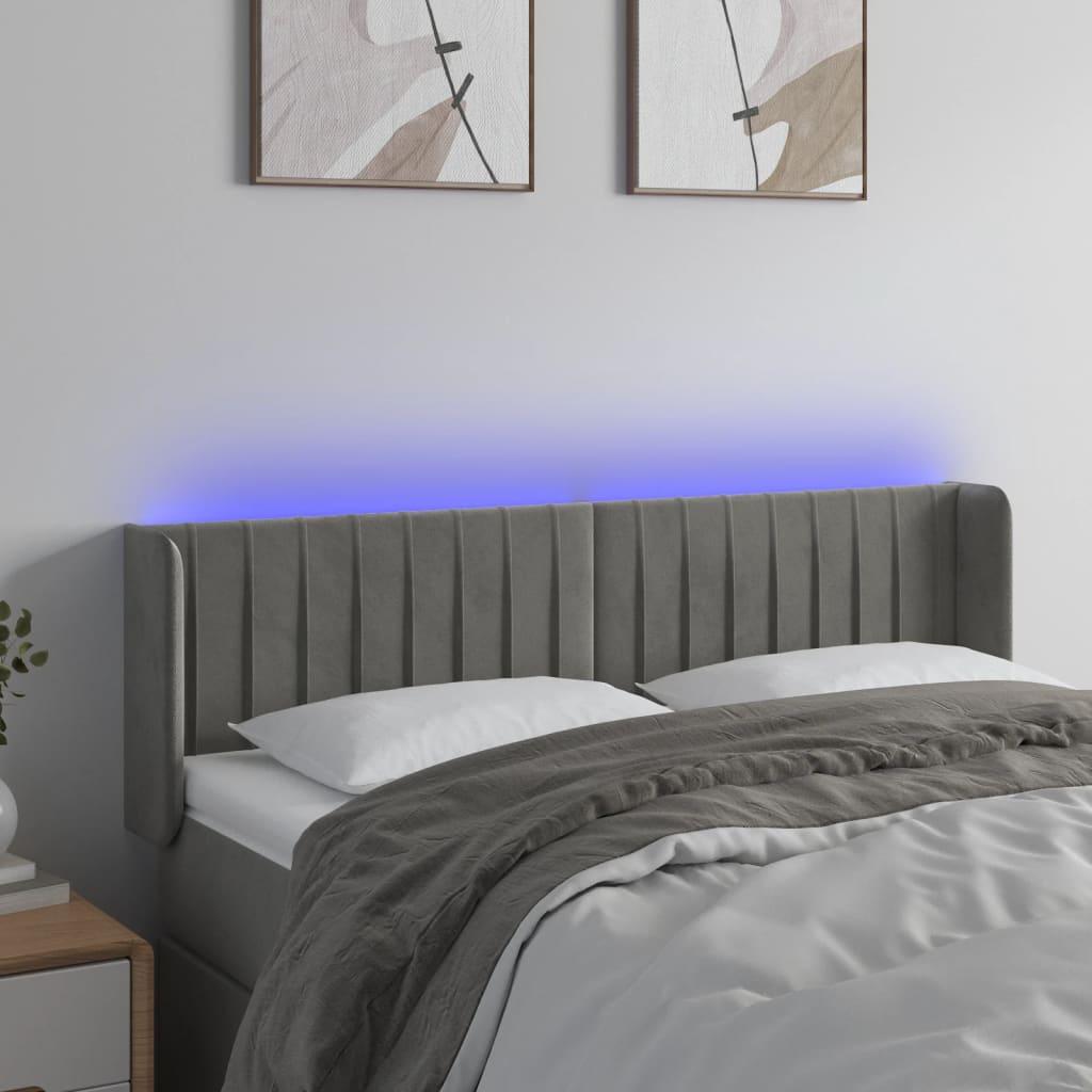 Sengegavl med LED-lys 147x16x78/88 cm fløjl lysegrå billede