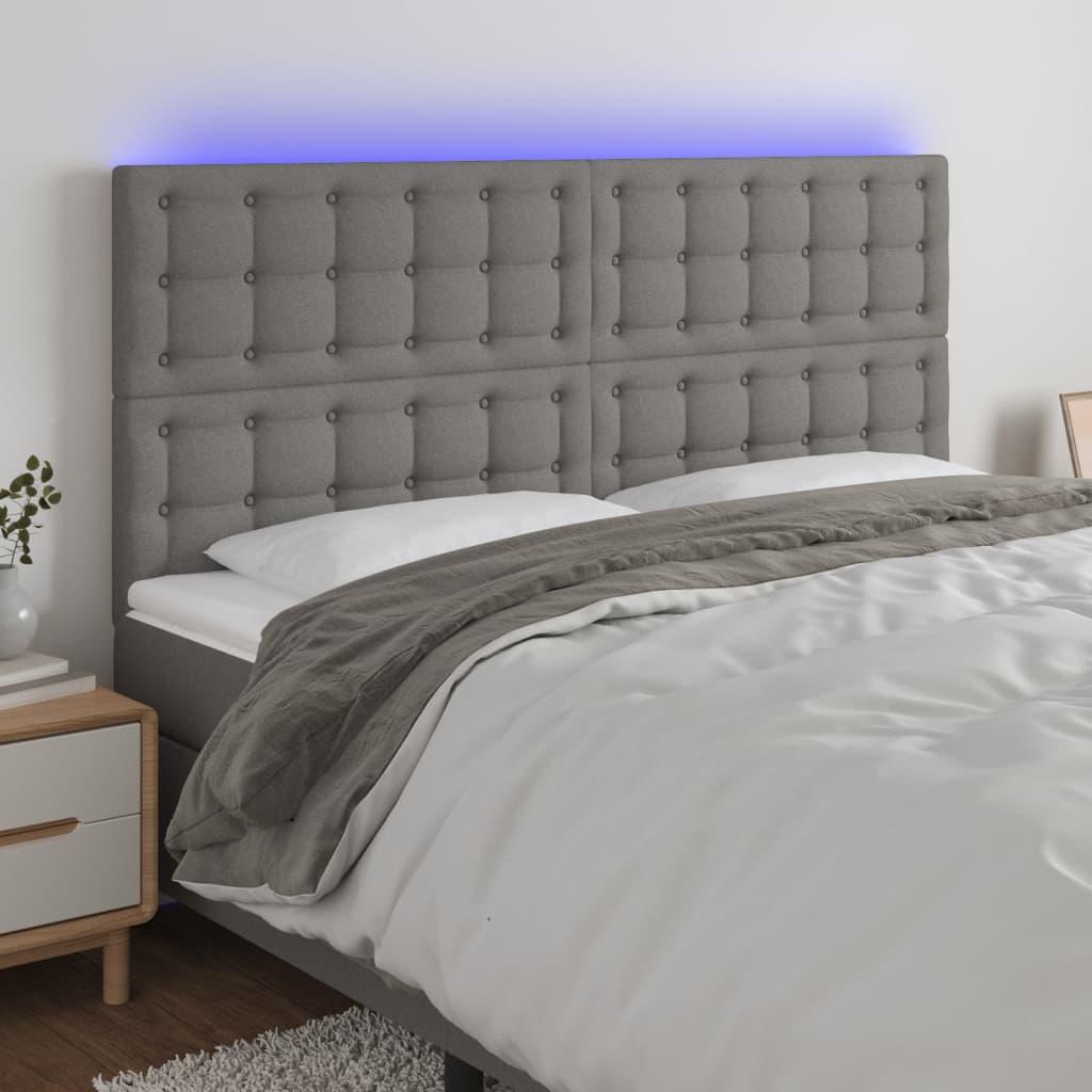 Sengegavl med LED-lys 180x5x118/128 cm stof mørkegrå billede