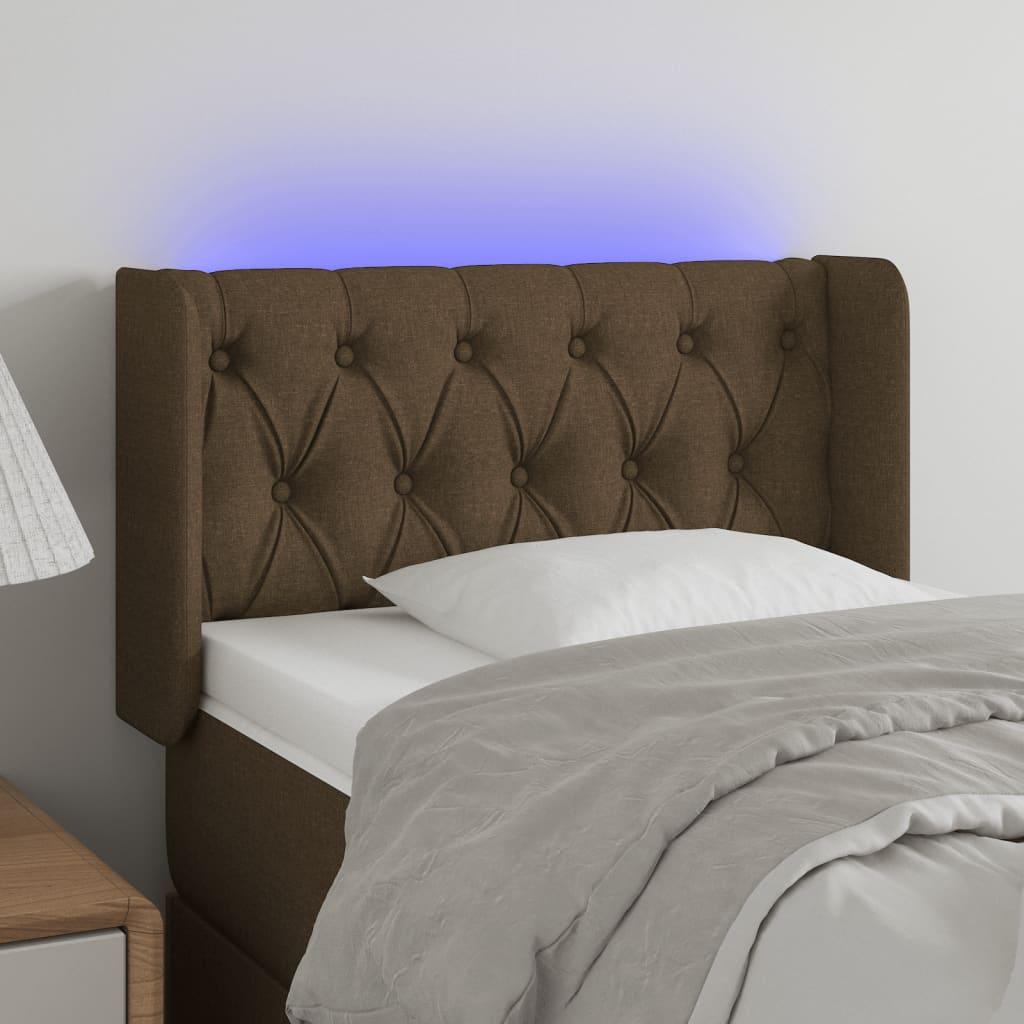 Sengegavl med LED-lys 83x16x78/88 cm stof mørkebrun billede