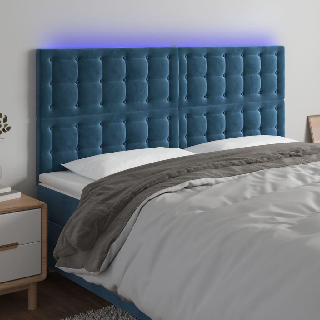 Sengegavl med LED-lys 160x5x118/128 cm fløjl mørkeblå billede