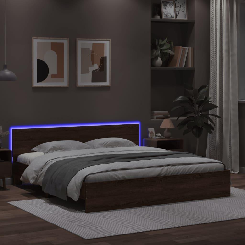 Sengeramme med sengegavl og LED-lys 180x200 cm brunt egetræ
