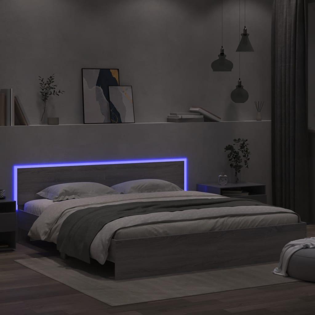 Sengeramme med sengegavl og LED-lys 180x200 cm grå sonoma-eg billede