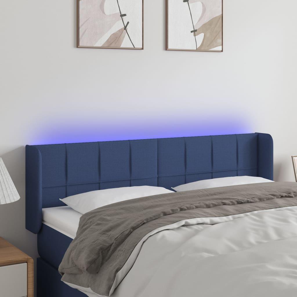 Sengegavl med LED-lys 147x16x78/88 cm stof blå billede