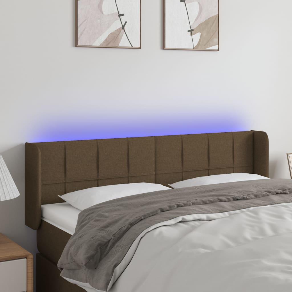 Sengegavl med LED-lys 147x16x78/88 cm stof mørkebrun billede