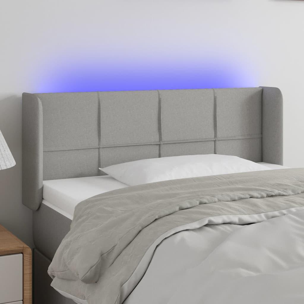 Sengegavl med LED-lys 103x16x78/88 cm stof lysegrå billede