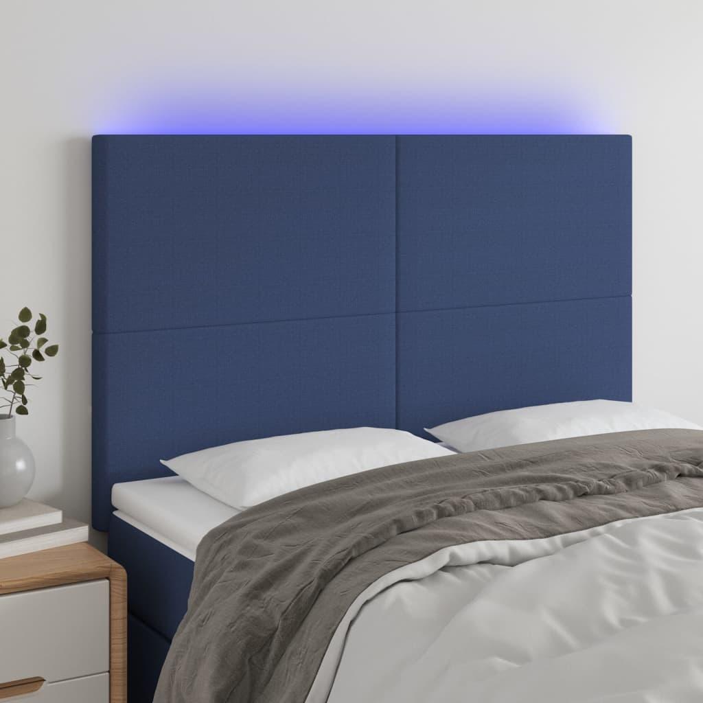 Sengegavl med LED-lys 144x5x118/128 cm stof blå billede