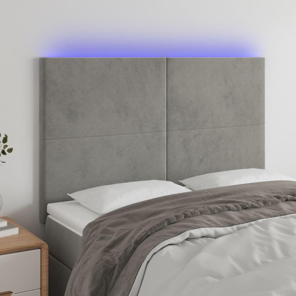 Sengegavl med LED-lys 144x5x118/128 cm fløjl lysegrå billede