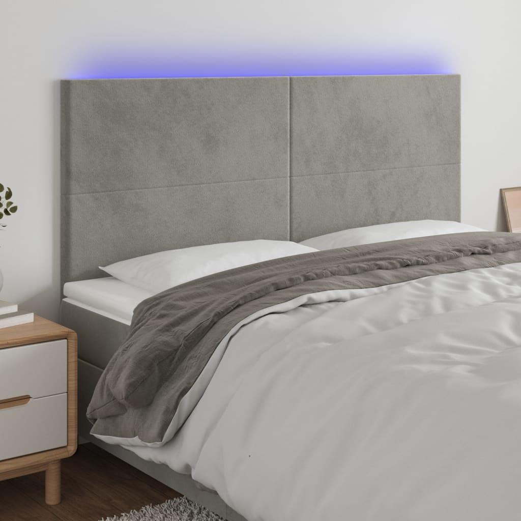 Sengegavl med LED-lys 200x5x118/128 cm fløjl lysegrå billede