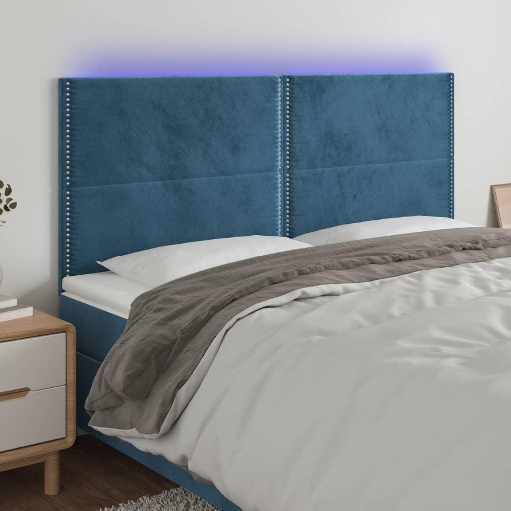Sengegavl med LED-lys 160x5x118/128 cm fløjl mørkeblå billede