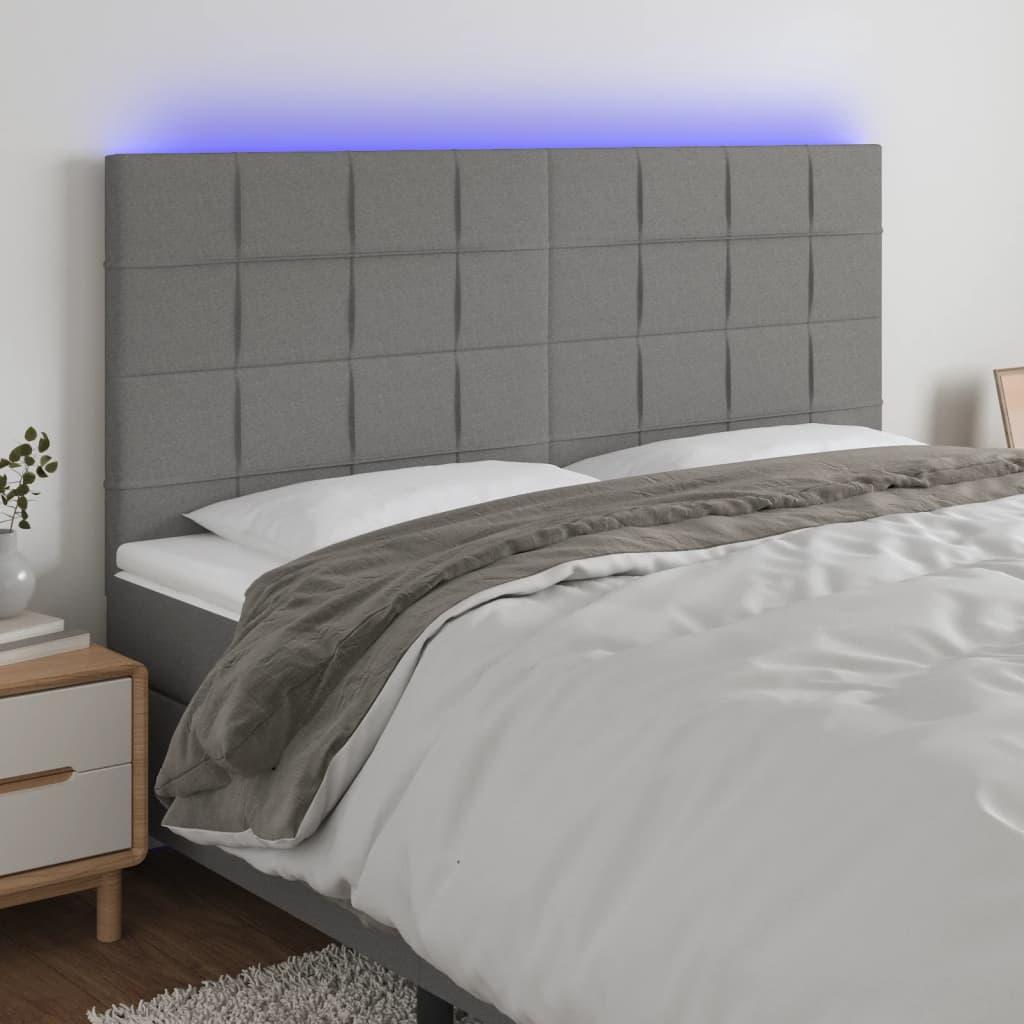 Sengegavl med LED-lys 160x5x118/128 cm stof mørkegrå billede