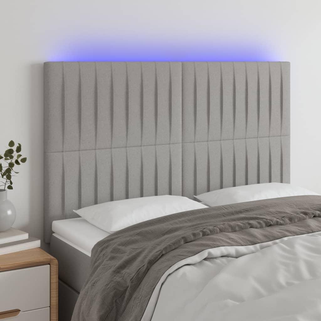 Sengegavl med LED-lys 144x5x118/128 cm - stof, lysegrå billede