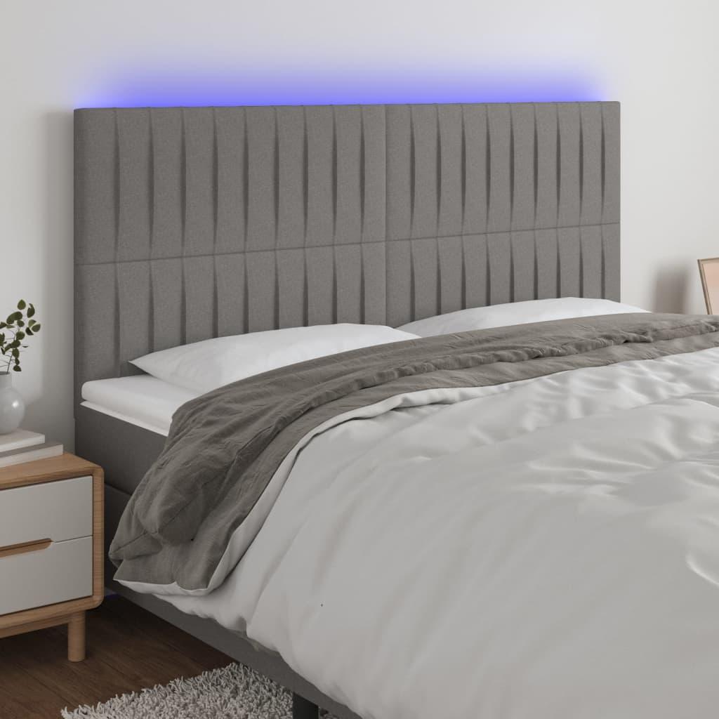 Sengegavl med LED-lys 180x5x118/128 cm stof mørkegrå billede