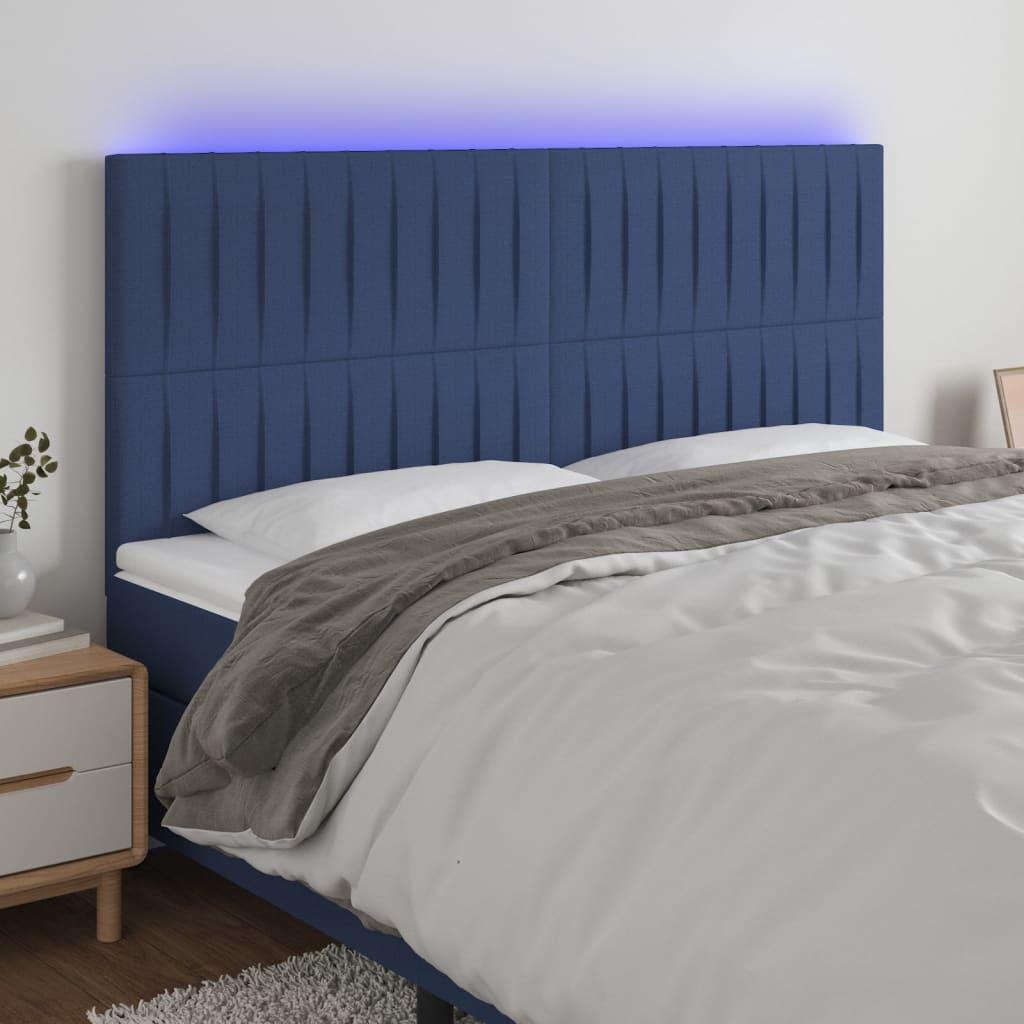 Sengegavl med LED-lys 200x5x118/128 cm stof blå billede