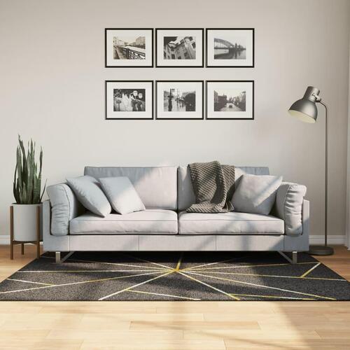 Gulvtæppe 120x180 cm vaskbart og skridsikkert sort + guldfarvet