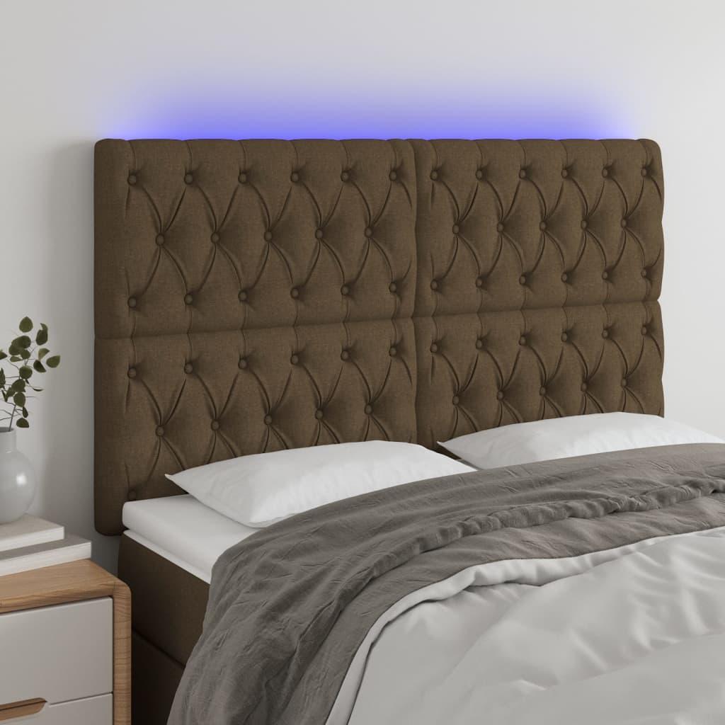 Sengegavl med LED-lys 144x7x118/128 cm stof mørkebrun billede