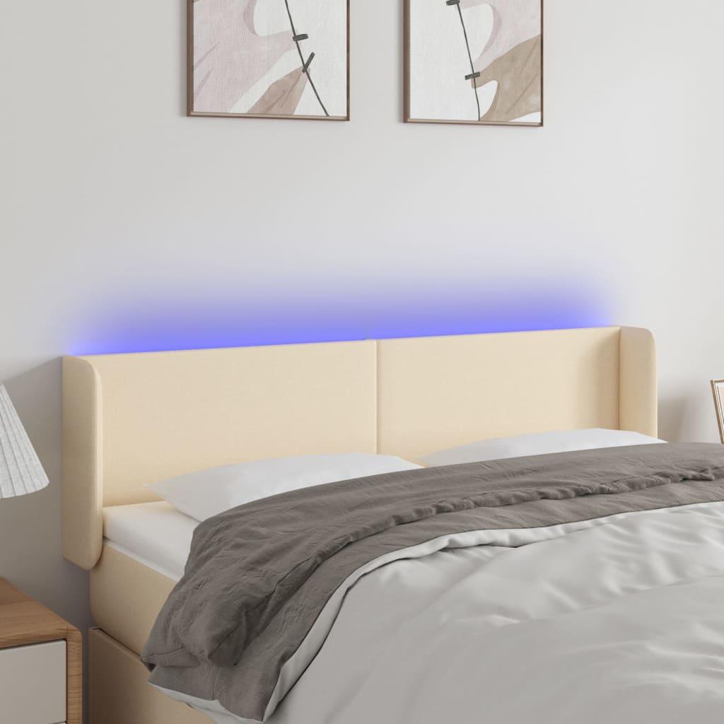 Sengegavl med LED-lys 147x16x78/88 cm stof cremefarvet billede