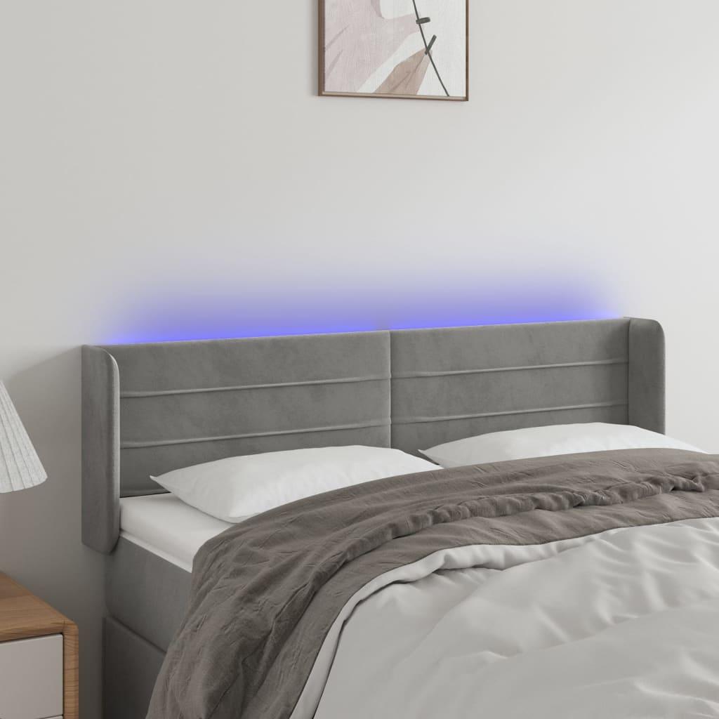 Sengegavl med LED-lys 147x16x78/88 cm fløjl lysegrå billede